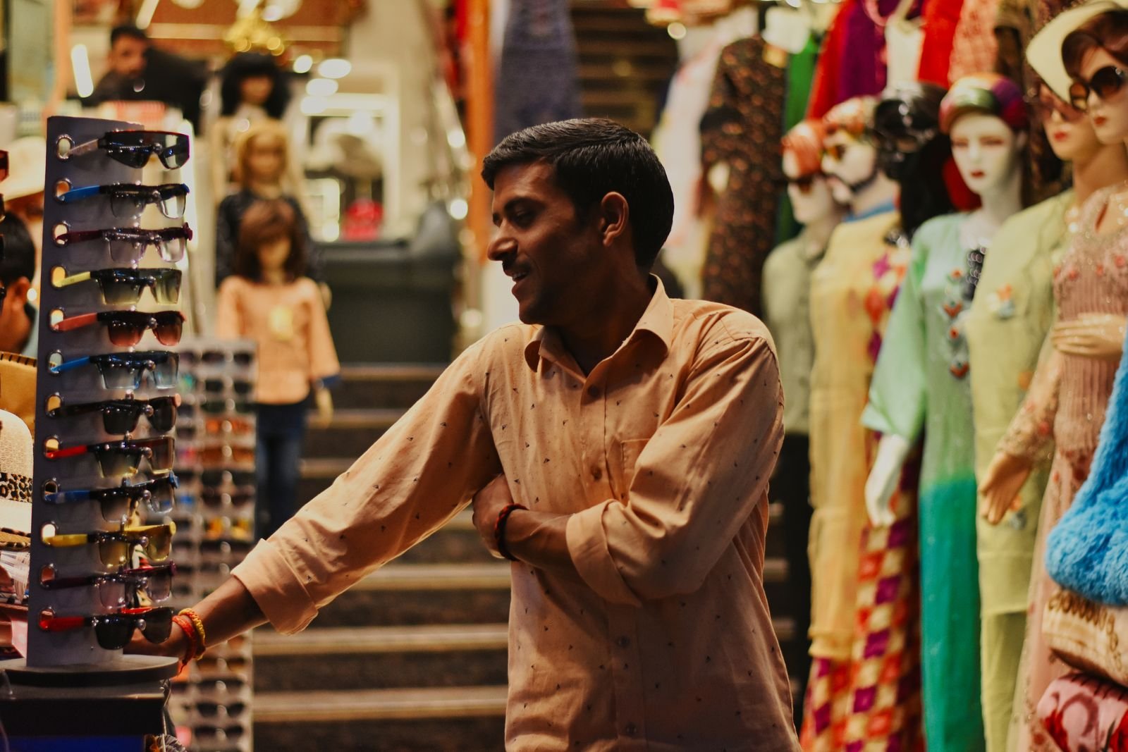 Fashion retailer at a market stall in India